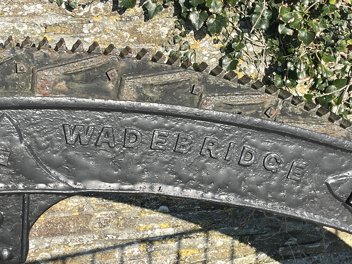 Photograph of restored historic waterwheel detail at Menadue Mill – Close-up image highlighting the cast iron and timber construction of the original 19th-century waterwheel, central to the mill's heritage.